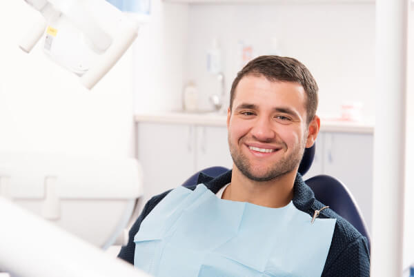 patient smiling after dental cleaning in Richardson, TX