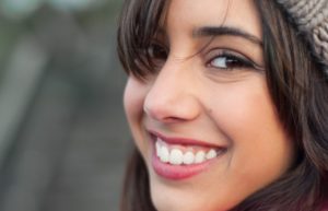 woman in hat smiling