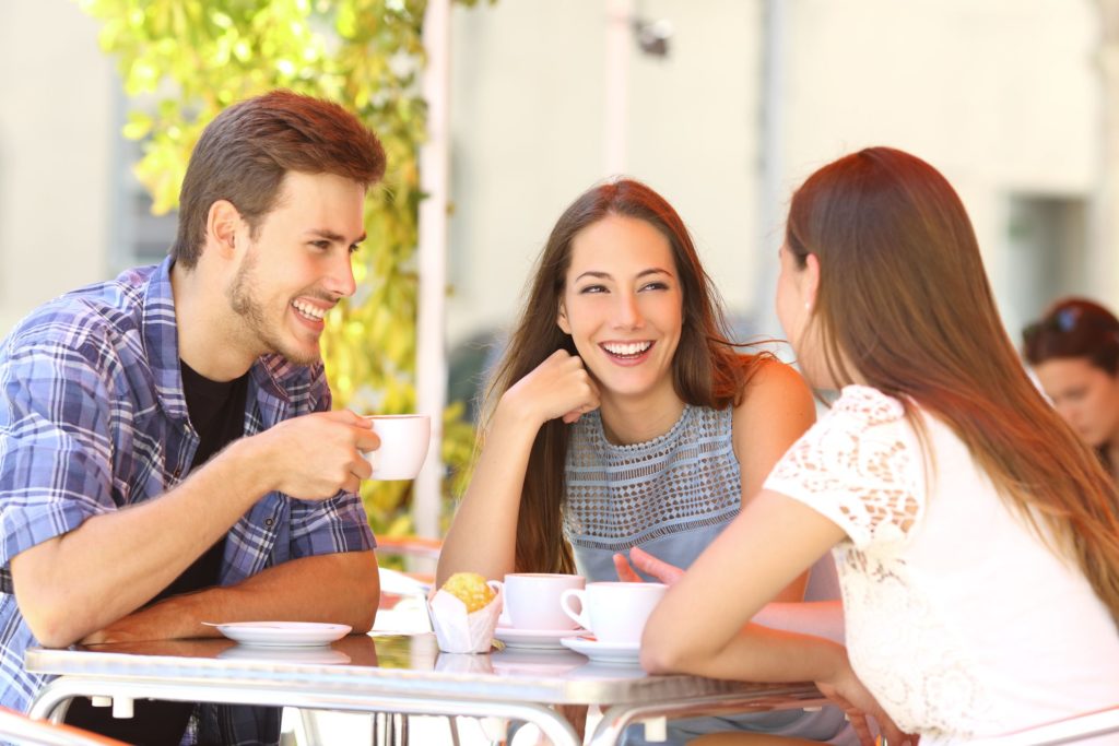 group of friends smiling together while at brunch