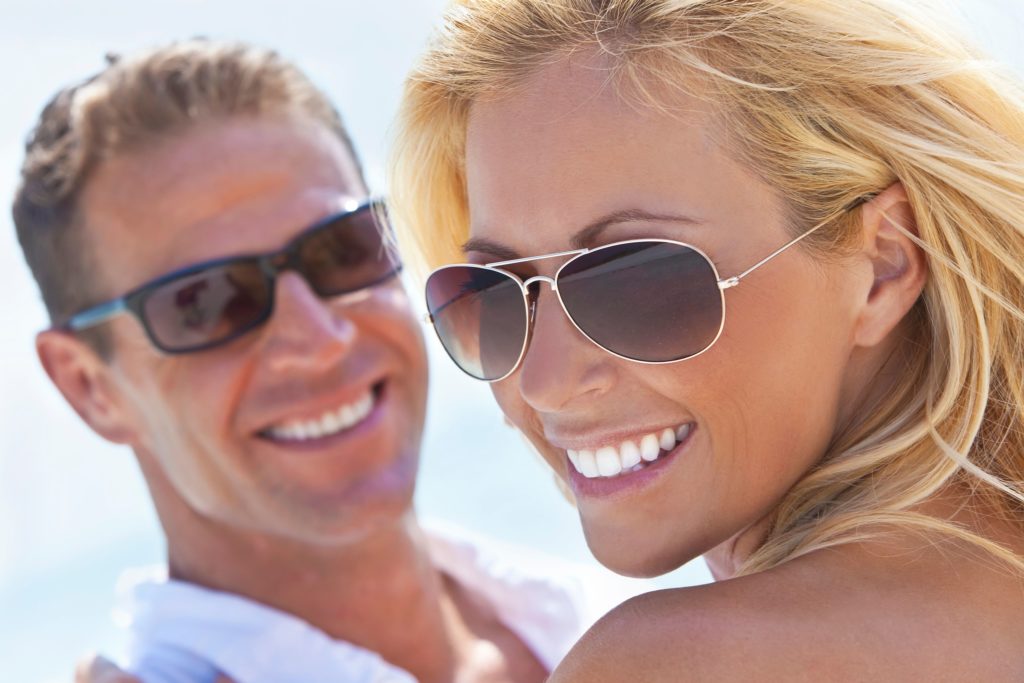 woman with dental implants smiling with her husband